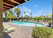 Thumbnail 11 of 23 - Pool deck at Verde Plaza Manufactured Home Community in Tucson, Arizona