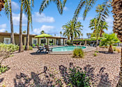 Thumbnail 13 of 23 - View of pool and landscaping at Verde Plaza Manufactured Home Community in Tucson, Arizona
