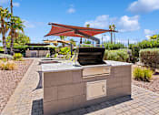 Thumbnail 14 of 23 - BBQ grill area at Verde Plaza Manufactured Home Community in Tucson, Arizona