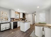 Thumbnail 4 of 15 - Model kitchen and dining area at Southfork MHC in Belton, MO