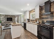 Thumbnail 3 of 15 - Model kitchen at Southfork MHC in Belton, MO