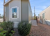 Thumbnail 19 of 19 - Model home exterior at Desert Valley Oasis MHC in Mesa, AZ.