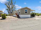 Thumbnail 9 of 23 - Model home exterior at Verde Plaza Manufactured Home Community in Tucson, Arizona
