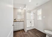 Thumbnail 17 of 25 - Model bathroom vanity and shower at Cedar Ridge Manufactured Home Community  in Wichita, Kansas