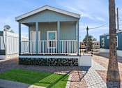 Thumbnail 17 of 19 - Model home exterior at Desert Valley Oasis MHC in Mesa, AZ.