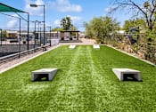 Thumbnail 19 of 23 - Cornhole courts at Verde Plaza Manufactured Home Community in Tucson, Arizona