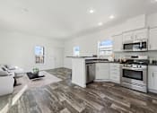 Thumbnail 2 of 19 - Model kitchen and dining area at Desert Valley Oasis MHC in Mesa, AZ.