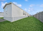 Thumbnail 21 of 25 - Model home side exterior at Cedar Ridge Manufactured Home Community  in Wichita, Kansas