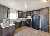 Thumbnail 3 of 23 - Model kitchen at Verde Plaza Manufactured Home Community in Tucson, Arizona