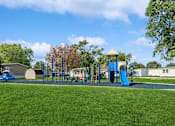 Thumbnail 13 of 14 - Community playground at Candlelight Village Manufactured Home Community in Sauk, IL