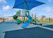 Thumbnail 23 of 25 - Community playground with sun cover at Cedar Ridge Manufactured Home Community  in Wichita, Kansas