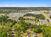 Thumbnail 8 of 8 - A bird's eye view of a residential area with houses and trees.