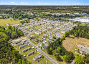 Thumbnail 6 of 8 - A bird's eye view of a residential area with houses and a road.