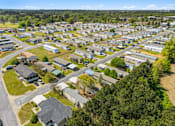 Thumbnail 7 of 8 - A bird's eye view of a residential area with houses and trees.