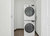 Thumbnail 36 of 45 - Two white front loading washing machines in a small room.