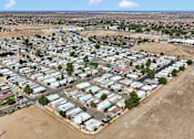 Thumbnail 3 of 23 - A large residential area with numerous houses and a road.