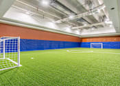 Thumbnail 6 of 45 - A soccer field with a goal post on the left side.