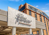 Thumbnail 2 of 45 - The Parker at Mike's Station building has a large sign on the front.