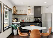 Thumbnail 6 of 16 - Community kitchen at Aldea Manufacture Home Community in Fort Worth, Texas