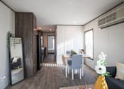 Thumbnail 3 of 16 - Model kitchen and dining area at Aldea Manufacture Home Community in Fort Worth, Texas
