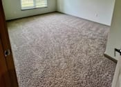 Thumbnail 20 of 21 - A room with a ceiling fan and carpeted floor.at Arbours at Moores Mill, Alabama