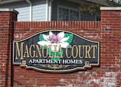 Thumbnail 1 of 21 - A Sign For Magnolia Court Apartment at Magnolia Court Apartments, Birmingham, AL, 35215