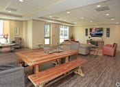 Thumbnail 22 of 32 - A conference room with a wooden table and chairs at Arbours at Tumblin Creek ~ Active 55+ Adult Community, Gainesville, FL 32608