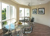 Thumbnail 28 of 32 - A conference room with a glass table and chairs at Arbours at Tumblin Creek ~ Active 55+ Adult Community, 32608