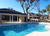 Thumbnail 4 of 18 - A swimming pool in front of a house at Arbours at Ensley Apartments, Florida