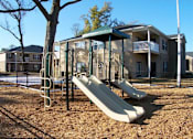 Thumbnail 8 of 18 - A beige building with a balcony and a staircase at Arbours at Ensley Apartments, Pensacola, 32514