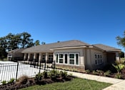 Thumbnail 3 of 5 - A house with a black fence in front of it at Arbours at Lake Charles, Lake Charles, 70605 