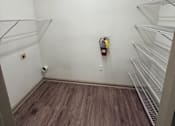 Thumbnail 14 of 17 - A room with a fire extinguisher on the wall.