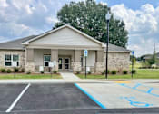 Thumbnail 8 of 21 - A building with a parking lot in front of it.at Arbours at Moores Mill, Huntsville, 35811