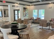 Thumbnail 4 of 7 - A Room With a Round Table and Chairs at Arbours at Quincy, Florida