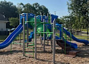 Thumbnail 7 of 7 - A Playground With a Blue and Green Slide at Arbours at Quincy, Quincy, FL, 32351