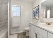 Thumbnail 12 of 27 - A white bathroom with a marble wall and a towel hanging on the window. at Chatham Hill, New Jersey, 07928