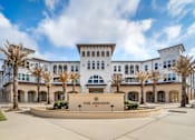 Thumbnail 1 of 13 - The front of a white building with a sign that says at The Addison,Louisiana
