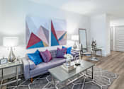 Thumbnail 37 of 55 - Grey sofa with blue pillows at Alys Crossing Apartments, TX, 77433