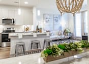 Thumbnail 26 of 55 - Kitchen with black appliances at Alys Crossing Apartments, Cypress