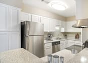 Thumbnail 8 of 20 - Kitchen with refrigerator at Arbors at Natchez Trace Apartments, Ridgeland, MS
