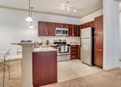Thumbnail 16 of 24 - Modern Kitchen at Broadstreet at EastChase Apartments, Alabama, 36117