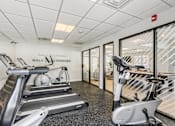 Thumbnail 5 of 27 - A gym with treadmills and a fire exit sign. at Chatham Hill, New Jersey, 07928