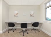 Thumbnail 13 of 51 - a conference room with a table and chairs and two paintings on the wall at Copper and Quarry Village, Maryland, 21209