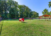 Thumbnail 50 of 51 - a park with a playground and a swing set at Copper and Quarry Village, Maryland, 21209
