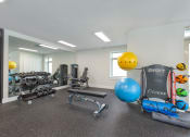 Thumbnail 15 of 51 - the preserve at ballantyne commons fitness room with weights and cardio equipment at Copper and Quarry Village, Maryland