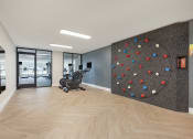 Thumbnail 18 of 51 - a rock climbing wall in a lobby with a chair at Copper and Quarry Village, Maryland, 21209
