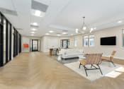 Thumbnail 41 of 51 - a rendering of a living room with a couch and chairs at Copper and Quarry Village, Pikesville, MD