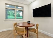 Thumbnail 42 of 51 - a dining area with a table and a tv on the wall at Copper and Quarry Village, Maryland