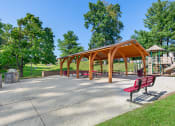 Thumbnail 45 of 51 - a park with benches and a picnic shelter at Copper and Quarry Village, Maryland