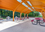 Thumbnail 46 of 51 - a covered picnic area with benches and tables at Copper and Quarry Village, Maryland, 21209
